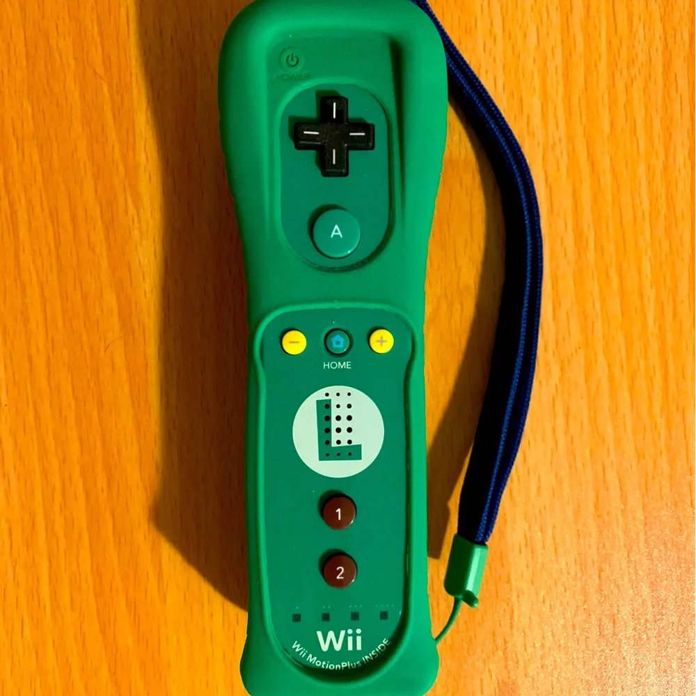 LUIGI THEMED WIIMOTE WITH WIIMOTE MOTION PLUS INSIDE. Used but works brand new.